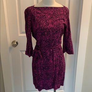 Bell sleeve boat neck dress.